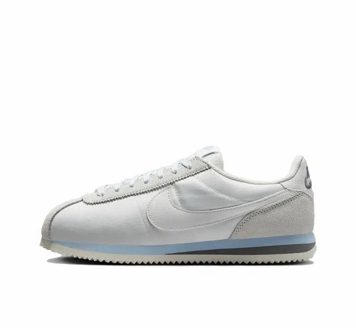 Nike Cortez low-top sneakers, white leather with blue accent sole