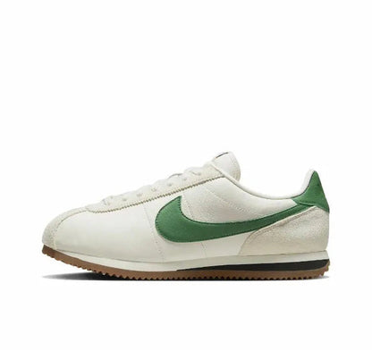 Nike Cortez low-top sneakers, white leather with green swoosh and gum sole