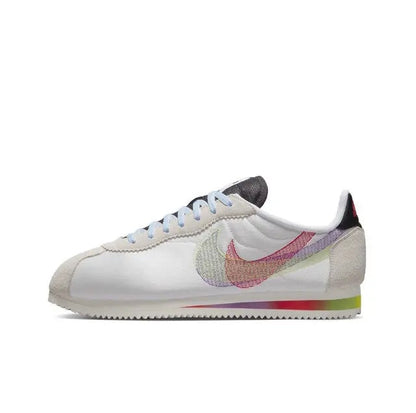 Nike Cortez sneakers, white leather with multicolor Swoosh and light-blue laces