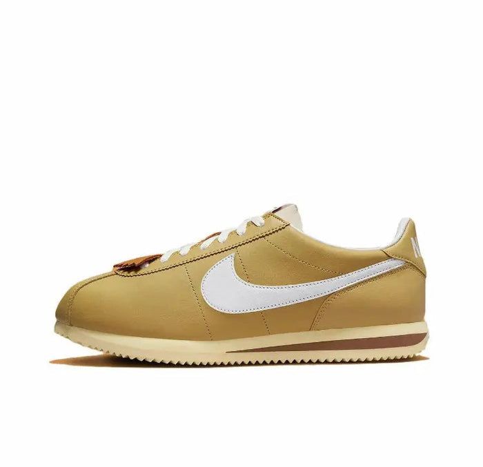 Nike Cortez sneakers in wheat gold with white Swoosh and brown outsole