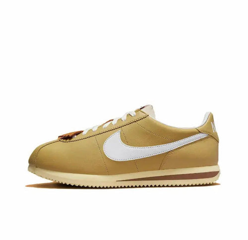 Nike Cortez sneakers in wheat gold with white Swoosh and brown outsole