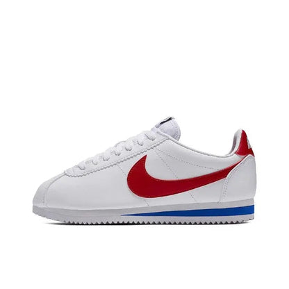 White Nike Cortez sneakers with red swoosh and blue sole stripe
