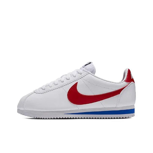 White Nike Cortez sneakers with red swoosh and blue sole stripe