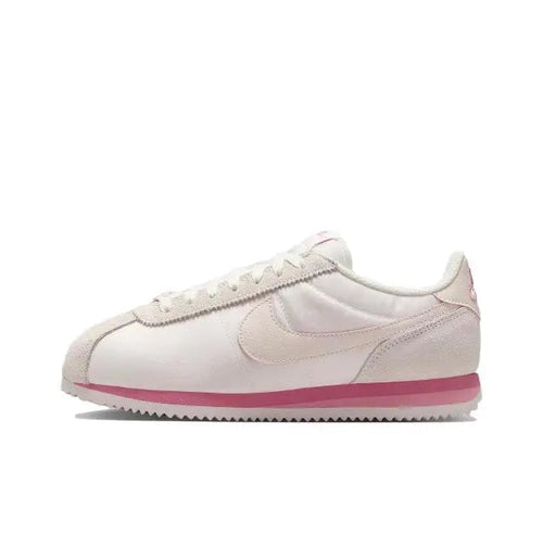 Nike Cortez low-top sneakers in light pink with pink swoosh and rubber outsole