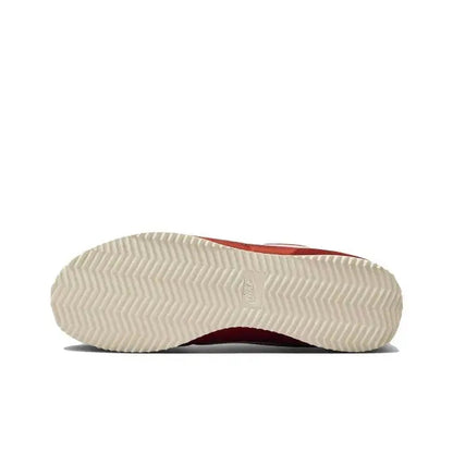 Red Cortez sneakers with white outsole edge and textured zigzag tread