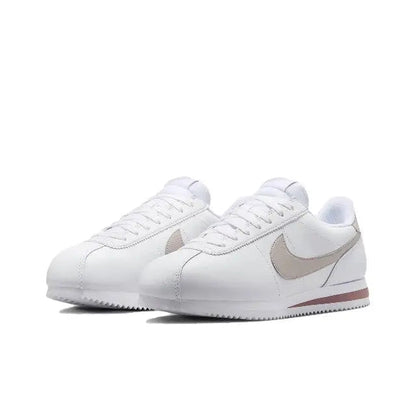 Low-top sneakers, white leather with beige swoosh and red-brown heel stripe