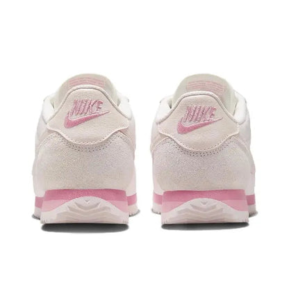 Nike Cortez sneakers heel view in light pink with pink logo and rubber sole