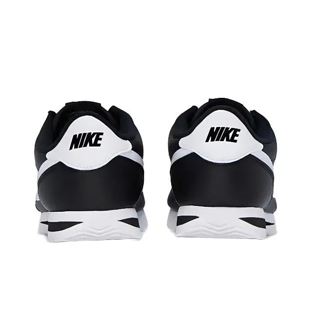 Black low-top sneaker heel with white NIKE logo and white midsole