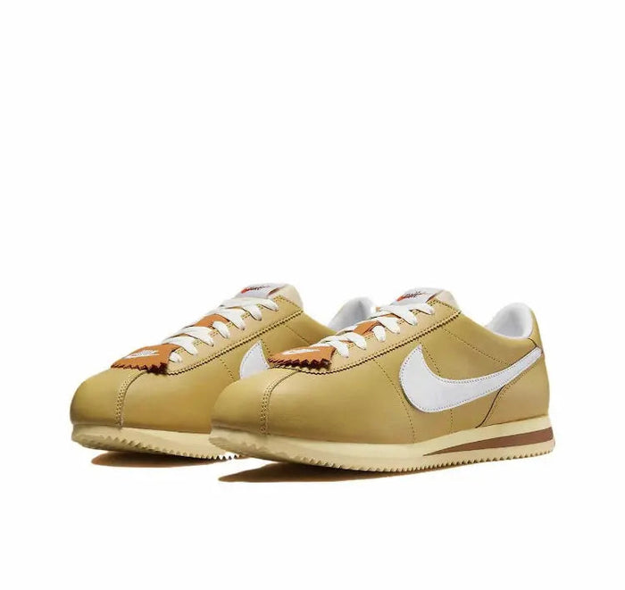 Cortez sneakers, wheat gold uppers with white Swoosh, lace-up and brown sole