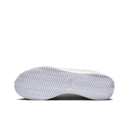 Nike Cortez outsole, white tread with textured herringbone pattern.