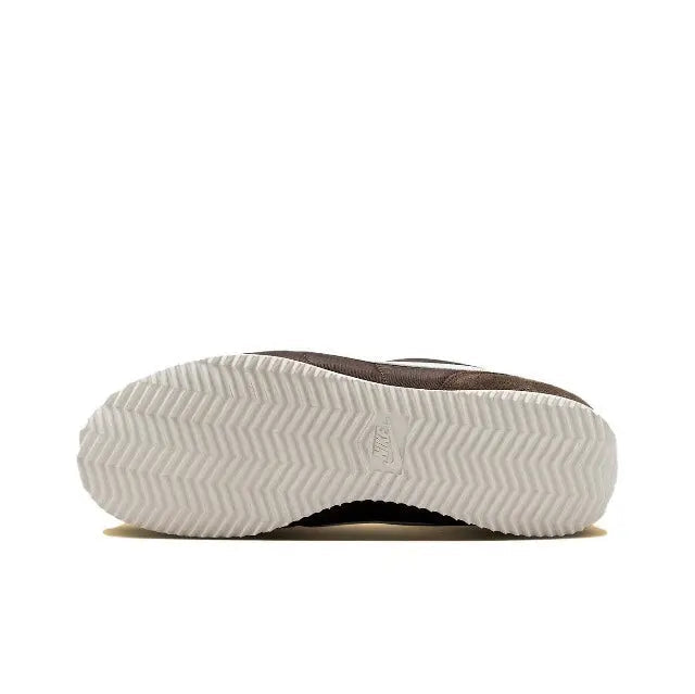 Nike Cortez outsole tread with zigzag pattern, dark brown heel and white rubber.