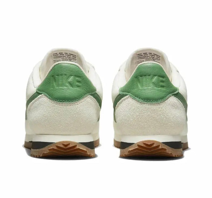 Low-top sneakers heels, white leather with green heel tab and gum outsole