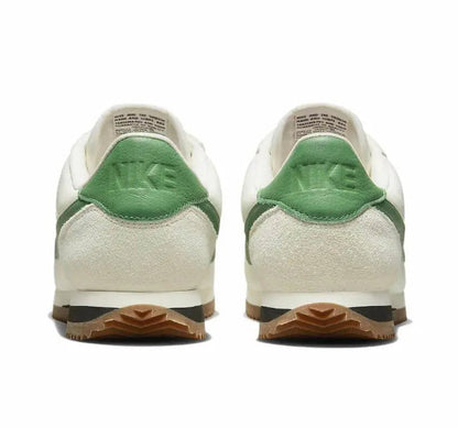 Low-top sneakers heels, white leather with green heel tab and gum outsole