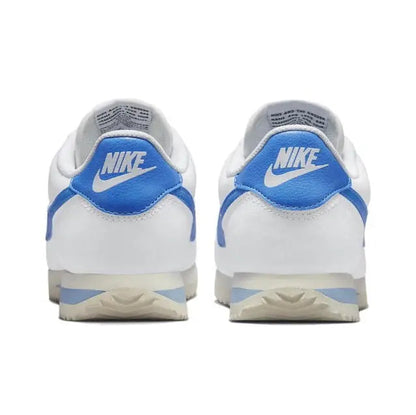 Nike Cortez sneakers back view pair, white uppers with blue heel and Nike logo