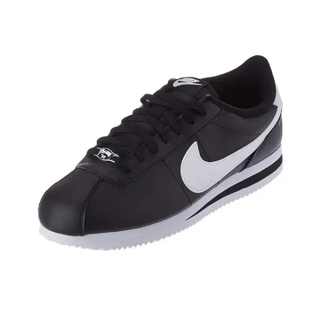 Black lace-up low-top sneaker with white swoosh and thick midsole