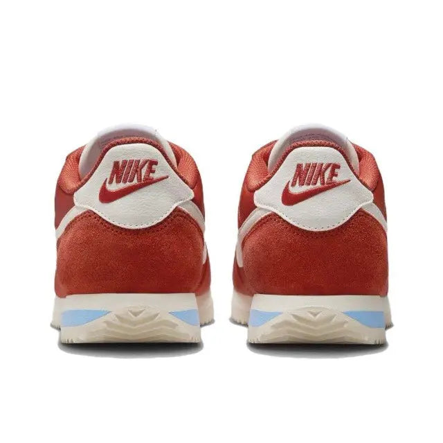 Cortez sneakers heel view with Nike logo, red suede, white collar