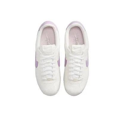 Cortez sneakers pair view, white laces with lilac heel accents
