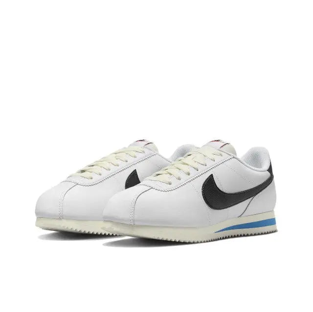 Nike Cortez low-top sneakers, white leather, black Swoosh, blue heel stripe, lace-up