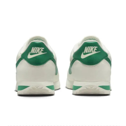 Low-top sneakers heel view, green back panel with Nike logo