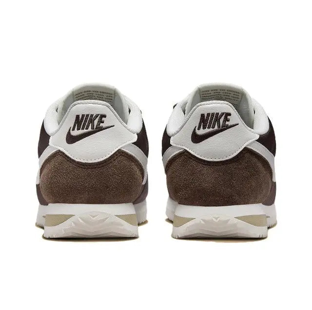 Nike Cortez sneakers heel view with NIKE branding, white heel tab and dark brown suede.