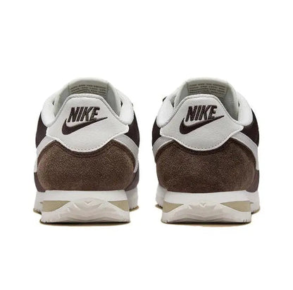 Nike Cortez sneakers heel view with NIKE branding, white heel tab and dark brown suede.