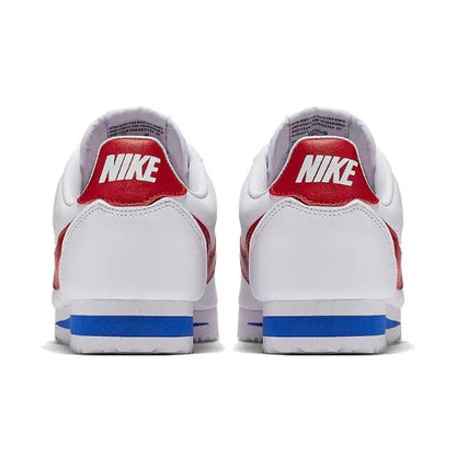 White Nike Cortez sneakers heel view with red Nike logo and blue sole stripe