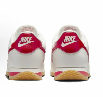 Cortez sneakers back view, white leather with red heel and gum sole