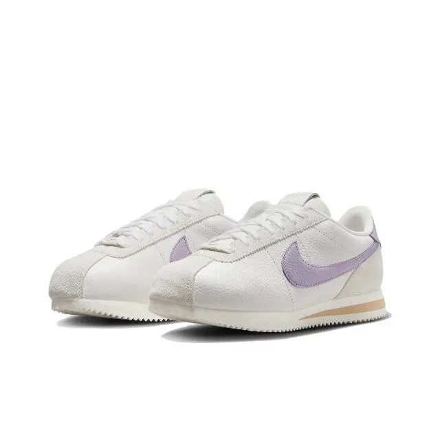 Cortez sneakers front angle, beige leather with lilac Swoosh