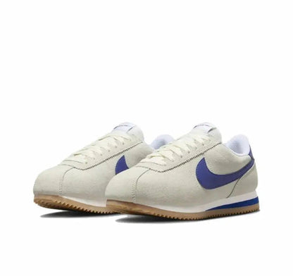 Cortez sneakers in off-white leather with blue swoosh and lace-up front