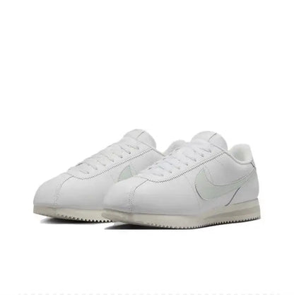 White low-top sneakers with Nike Swoosh and lace-up front