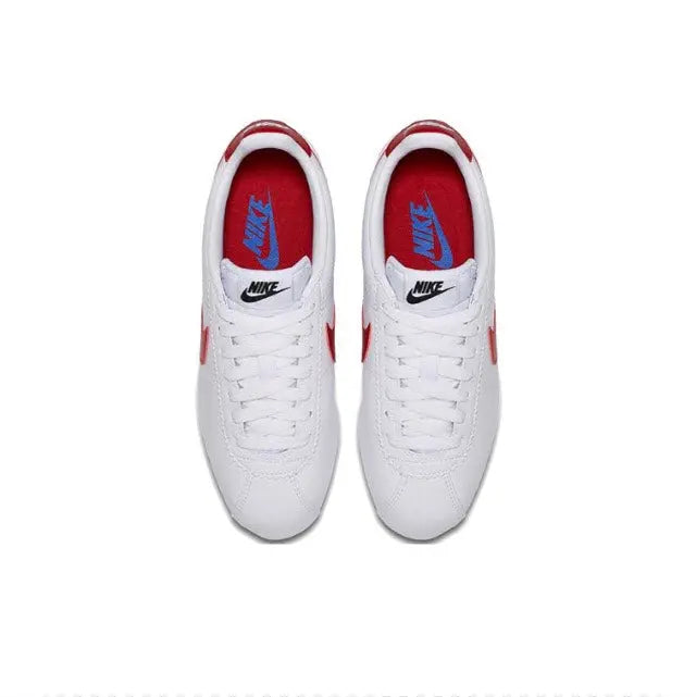 White Nike Cortez sneakers with red-lined tongue and blue Nike heel logo