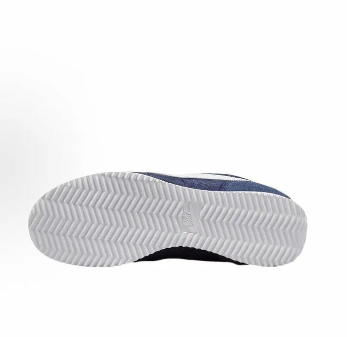 Dark blue and white outsole tread on low-top sneakers