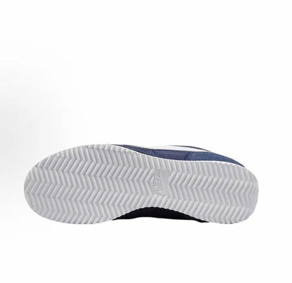 Dark blue and white outsole tread on low-top sneakers
