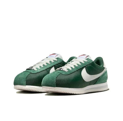 Nike Cortez sneakers, dark green with white Swoosh and cream laces, side view.