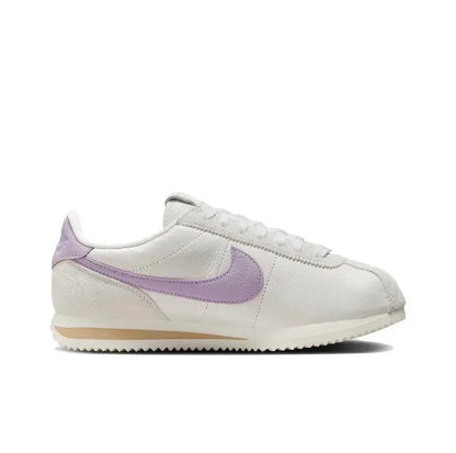 Cortez sneakers side view, lilac Swoosh on beige upper