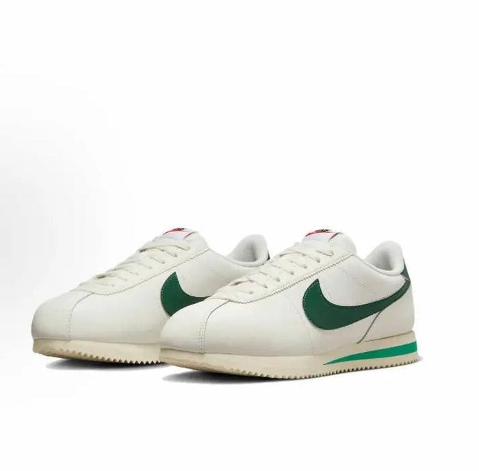 Cortez sneakers in white with green swoosh and cream textured sole