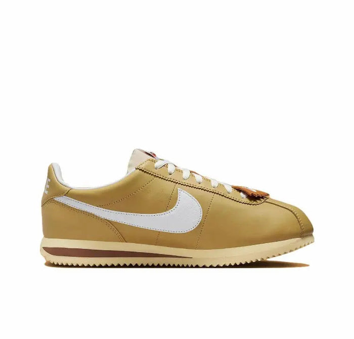Cortez sneakers side view, wheat gold leather with white Swoosh and brown outsole