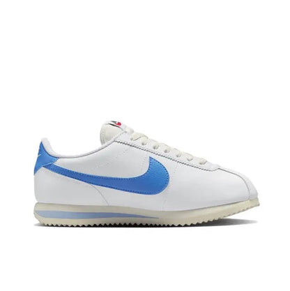 Nike Cortez sneakers side view, white with blue swoosh and rubber cupsole