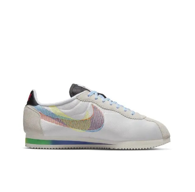 Nike Cortez sneakers, white low-top with rainbow Swoosh and multicolor lining at heel