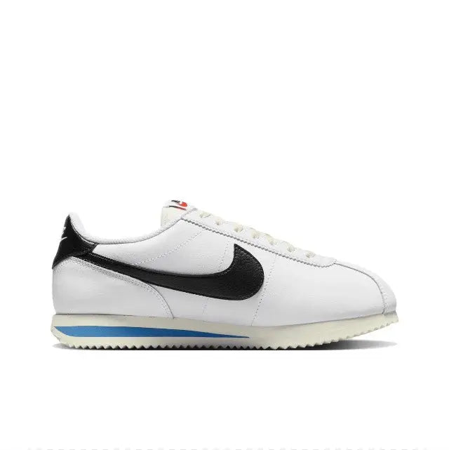 Nike Cortez low-top sneakers, white leather with black Swoosh and blue outsole stripe