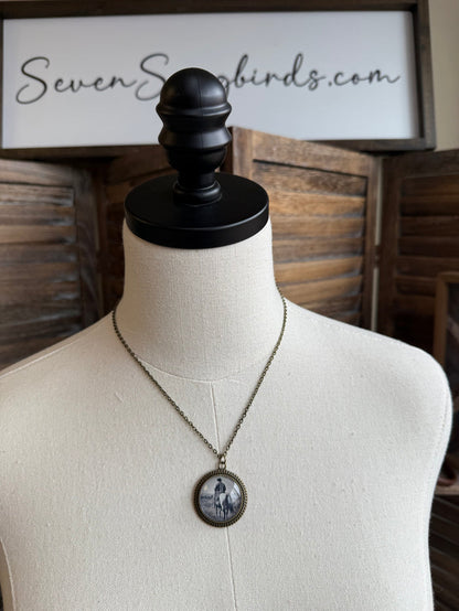Cowboy glass pendant necklace with round pendant and chain, featuring cowboy and horse