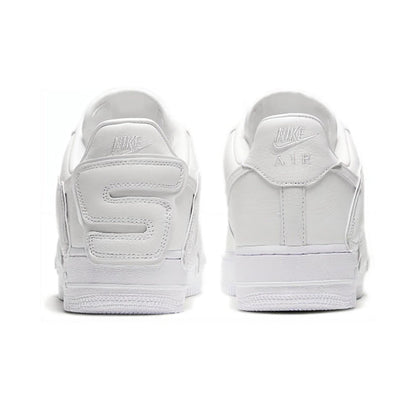 White low-top sneaker heel view with Nike branding on the back tabs.