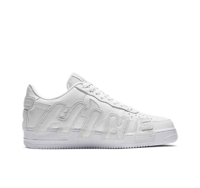 White low-top sneaker side profile with tonal logo paneling and perforated toe.