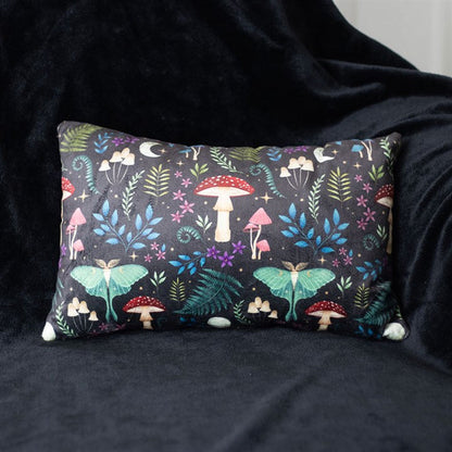 dark forest themed rectangular cushion shown styled on sofa for home decor display