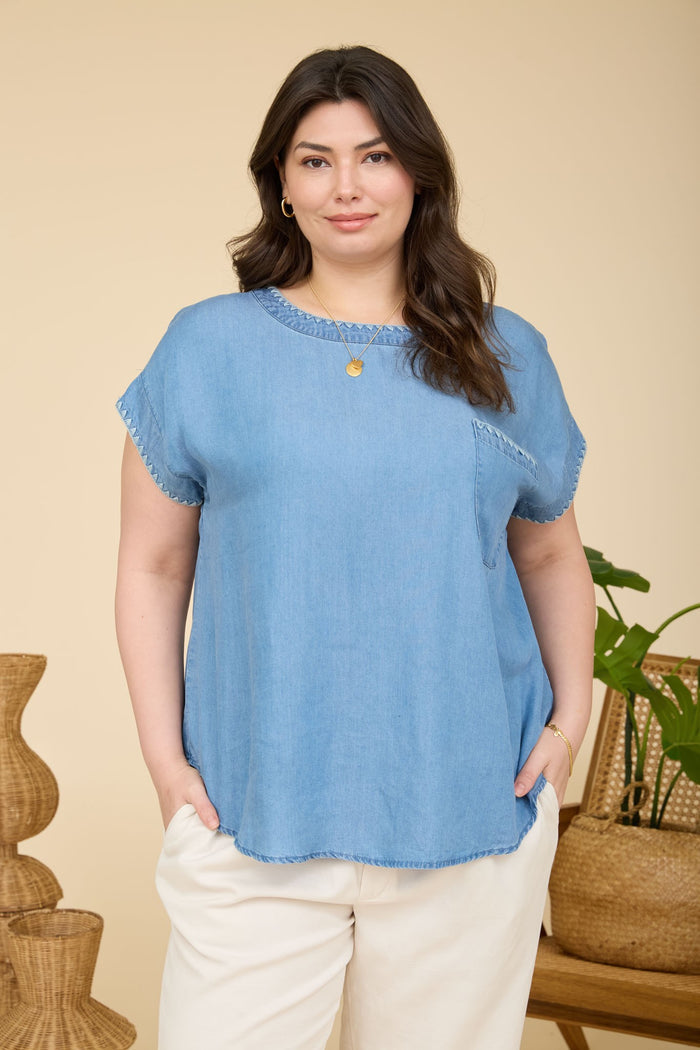 Light blue denim short-sleeve shirt with whip-stitched scalloped edges