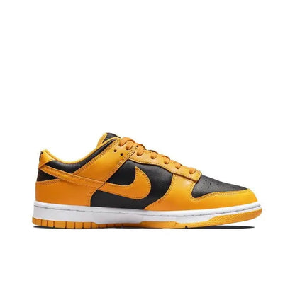 Low-top sneakers with orange and black panels, yellow laces, white midsole