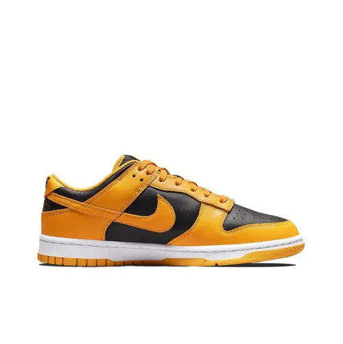 Low-top sneakers with orange and black panels, yellow laces, white midsole