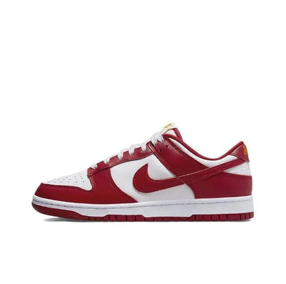 Nike Dunk Low low-top sneakers in white and red with bold Swoosh and lace-up front