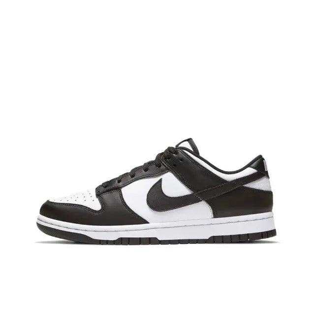 Nike Dunk Low low-top sneakers in black and white, side view with swoosh