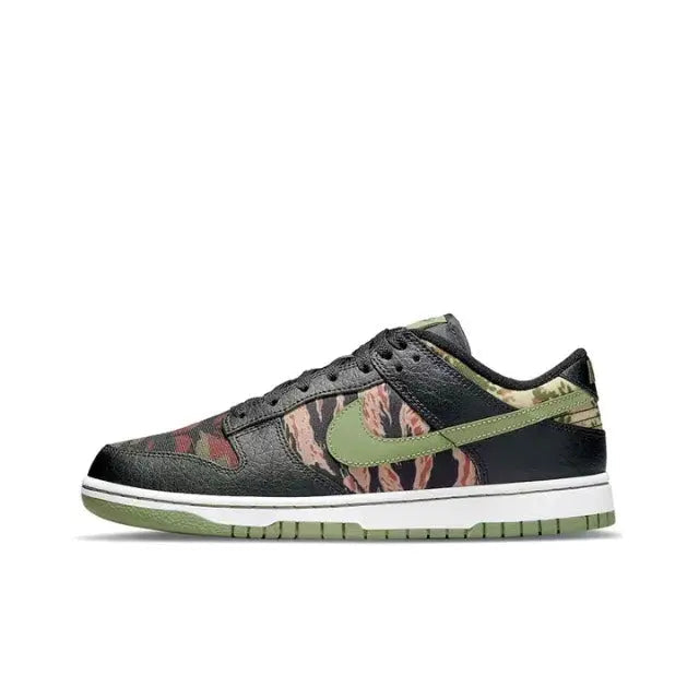 Nike Dunk Low sneakers in black with multicolor camo print and green Swoosh